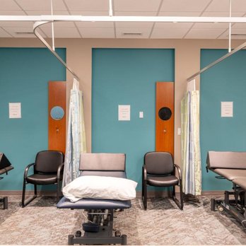 Trust Care Physiotherapy - Wide treatment room at Trust Care Physiotherapy with multiple treatment tables in a clean clinical setting. - Physical Therapy Near Me - Edmonton, Alberta Trust Care Physiotherapy - Wide treatment room at Trust Care Physiotherapy with multiple treatment tables in a clean clinical setting. - Physical Therapy Near Me - Edmonton, Alberta