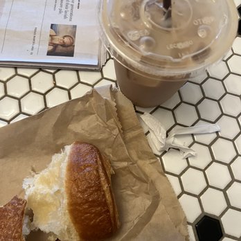 Fremont Coffee - iced chai latte with oat milk and part of a croissant - Coffee & Tea Near Me - Seattle, Washington Fremont Coffee - iced chai latte with oat milk and part of a croissant - Coffee & Tea Near Me - Seattle, Washington