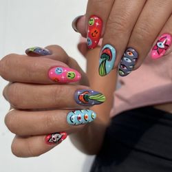 Santa Monica Nails - Hand-painted designs: Using fine brushes and nail polish to create detailed designs like flowers, animals, and abstract patterns.