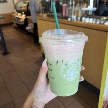 Starbucks - a hand holding a cup of green tea - Coffee & Tea Near Me - El Segundo, California Starbucks - a hand holding a cup of green tea - Coffee & Tea Near Me - El Segundo, California