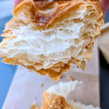 Intelligentsia Coffee - Peeling back the chocolate croissant - Coffee & Tea Near Me - Austin, Texas Intelligentsia Coffee - Peeling back the chocolate croissant - Coffee & Tea Near Me - Austin, Texas