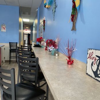 Conch Heaven 2 Go - a long table with chairs - Caribbean Near Me - Plantation, Florida