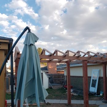 NoCo Landscapes and Irrigation - a patio with an umbrella - Landscaping Near Me NoCo Landscapes and Irrigation - a patio with an umbrella - Landscaping Near Me