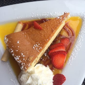 La Isla Restaurant - Coconut Mango Cheesecake with Mango Sauce - Cuban Near Me - Hoboken, New Jersey