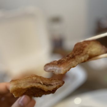 A-Hyang - a hand holding a piece of bacon - Korean Near Me - Duluth, Georgia A-Hyang - a hand holding a piece of bacon - Korean Near Me - Duluth, Georgia