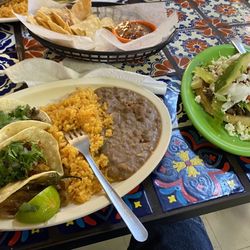 Cosina Mexicana - 1 Chicharron Taco, 1 Bistec Taco, and Rice and Beans. The dish on the right was a Sopes.