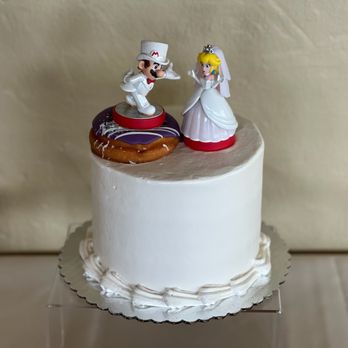 Love At First Bite - My wedding cake of coconut with shredded coconut frosting and buttercream on the outside; delish! - Bakeries Near Me - Berkeley, California
