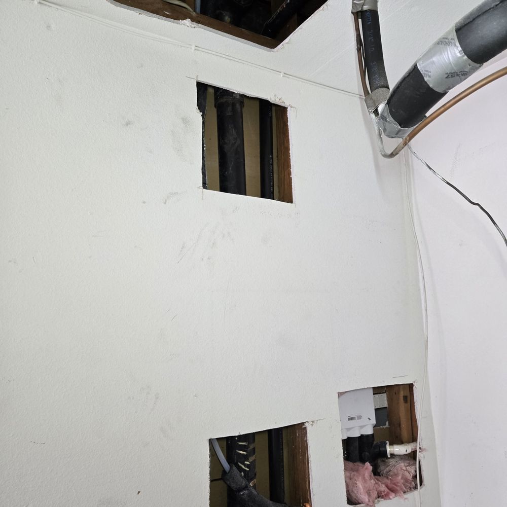Repipe Top Team - garage wall - repipe day - Plumbing Near Me - Costa Mesa, California Repipe Top Team - garage wall - repipe day - Plumbing Near Me - Costa Mesa, California