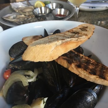 Plank Provisions - Getting started with Oysters on the half shell and some steamed mussels.. Oh.. And a glass of Chardonnay! - Seafood Near Me - Omaha, Nebraska Plank Provisions - Getting started with Oysters on the half shell and some steamed mussels.. Oh.. And a glass of Chardonnay! - Seafood Near Me - Omaha, Nebraska