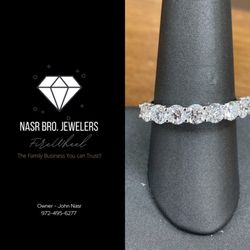 Nasr Bros Jewelers - Almost Flawless diamonds on wedding band