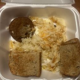 Rye toast, sausage patties, hash-browns, and eggs. Rye toast, sausage patties, hash-browns, and eggs.