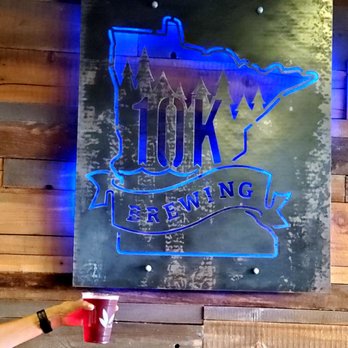 10K Brewing - a neon sign on a wooden wall - Breweries Near Me - Anoka, Minnesota 10K Brewing - a neon sign on a wooden wall - Breweries Near Me - Anoka, Minnesota