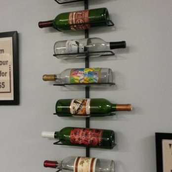 Water 2 Wine - One of their racks, displaying the different custom wine examples! - Beer, Wine & Spirits Near Me - Austin, Texas