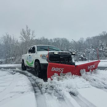 Mr Ax Landscaping - a snow plow in the snow - Landscaping Near Me Mr Ax Landscaping - a snow plow in the snow - Landscaping Near Me