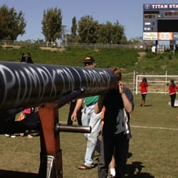 Pumpkin Launch - Kid looking down the barrel of the Pumpkin Lobber, which shot a pumpkin and medicine ball through the scoreboard