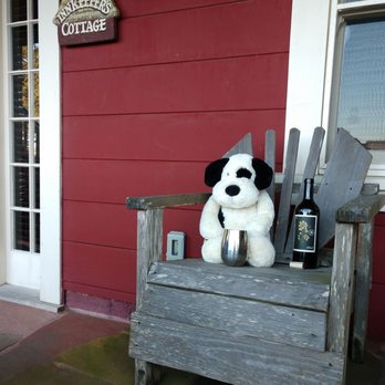 Nick's Cove Cottages - DoggieBear chilling at his cottage with a Reynolds Merlot. Such a player. Totally gets the coveted "DoggieBear Paw Print Stamp" of approval. - Hotels Near Me - Marshall, California