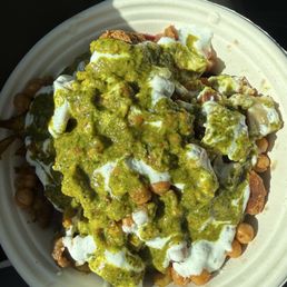 Bowl with couscous, hummus, crispy chicken, chicken Shawarma, falafel, chickpea croutons, tzatziki, and Grandma's hot sauce Bowl with couscous, hummus, crispy chicken, chicken Shawarma, falafel, chickpea croutons, tzatziki, and Grandma's hot sauce