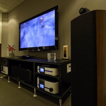 Visolution TV - B&W Nautilus Speakers with TV mounted above audio video component stand - General Contractors Near Me Visolution TV - B&W Nautilus Speakers with TV mounted above audio video component stand - General Contractors Near Me