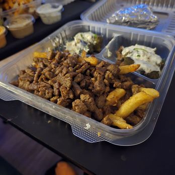 Yanni's Greek Grill - Beef shawarma with garlic feta fries and dolmades. - Greek Near Me - Las Vegas, Nevada Yanni's Greek Grill - Beef shawarma with garlic feta fries and dolmades. - Greek Near Me - Las Vegas, Nevada