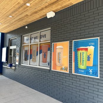 Dutch Bros Coffee - Walk up window with drink posters on wall - Juice Bars & Smoothies Near Me - Martinez, California