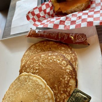 Warren's Cafe - Sausage egg & cheese breakfast sandwich and chocolate chip pancakes - American Near Me - Hoschton, Georgia