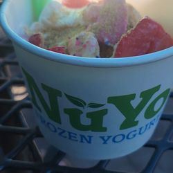 Small cup of frozen yogurt and toppings