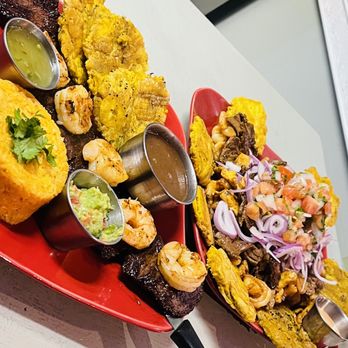 Mojitos Latin Cuisine - Grilled skirt steak served with grilled shrimps, rice, beans, fried green plantains. - Latin American Near Me - Hamden, Connecticut Mojitos Latin Cuisine - Grilled skirt steak served with grilled shrimps, rice, beans, fried green plantains. - Latin American Near Me - Hamden, Connecticut