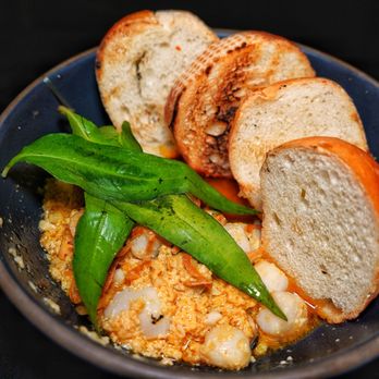 Xóm - Baby scallop and mussels in a butter garlic sauce with toast baguette - Vietnamese Near Me - Seattle, Washington Xóm - Baby scallop and mussels in a butter garlic sauce with toast baguette - Vietnamese Near Me - Seattle, Washington