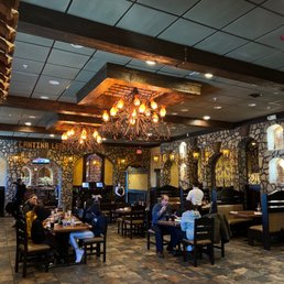 people sitting at tables in a restaurant