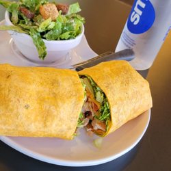 Muscle Maker Grill - MMG Wrap with side salad.
