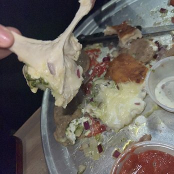Origin Craft Beer and Pizza Cafe - Another raw Stromboli picture. Stretching dough - Pizza Near Me - Bradenton, Florida Origin Craft Beer and Pizza Cafe - Another raw Stromboli picture. Stretching dough - Pizza Near Me - Bradenton, Florida