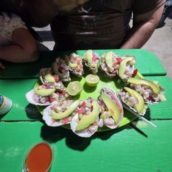 Prepared oyster with avocado limon and chile.