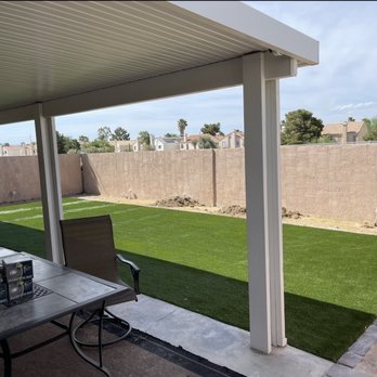 Vision Landscape - a patio with a table and chairs - Tree Services Near Me Vision Landscape - a patio with a table and chairs - Tree Services Near Me