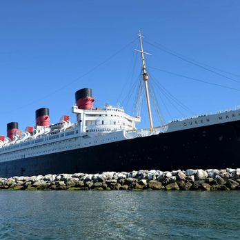 The Queen Mary - A beautiful waterside view of the Queen Mary as we sailed by on a water taxi. - Hotels Near Me - Long Beach, California The Queen Mary - A beautiful waterside view of the Queen Mary as we sailed by on a water taxi. - Hotels Near Me - Long Beach, California