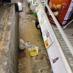 Floor of the dairy case to the left