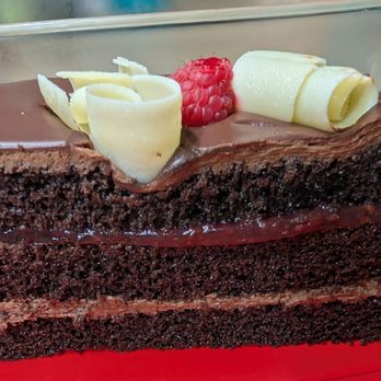 Porto's Bakery & Cafe - Very very thin layer of raspberry and dry cake - Bakeries Near Me - Glendale, California Porto's Bakery & Cafe - Very very thin layer of raspberry and dry cake - Bakeries Near Me - Glendale, California