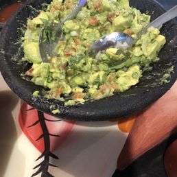 Guacamole made at the table fresh