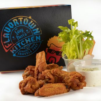 Guy Fieri's Flavortown Kitchen - a box of chicken nuggies and a cup of ranch dressing - Food Delivery Services Near Me Guy Fieri's Flavortown Kitchen - a box of chicken nuggies and a cup of ranch dressing - Food Delivery Services Near Me