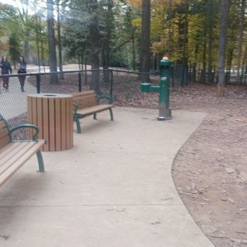 Dinius Off-Leash Dog Area - Couple benches and water fountain Plus the trash can and some people walking up the sidewalk - Recreation Centers Near Me - Auburn, Alabama Dinius Off-Leash Dog Area - Couple benches and water fountain Plus the trash can and some people walking up the sidewalk - Recreation Centers Near Me - Auburn, Alabama