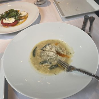Lulu's - Raviolo (one large ravioli) filled with short rib and an egg (you can see the yolk dripping out) - Italian Near Me - Round Top, Texas