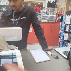 Cellaxs - Worst cashier ever as soon as he could he spoke Arabic and we couldn't understand anything he said