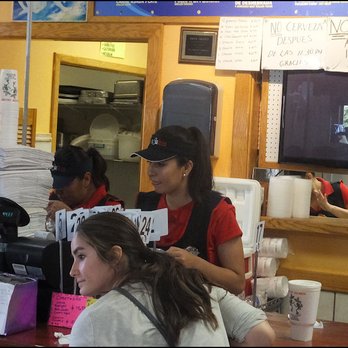 Tacos Jalisco - On this early Thursday evening in September, the order counter is very busy. Note the sign that states "No beer after 11:30 pm." - Mexican Near Me - Dodge City, Kansas Tacos Jalisco - On this early Thursday evening in September, the order counter is very busy. Note the sign that states "No beer after 11:30 pm." - Mexican Near Me - Dodge City, Kansas