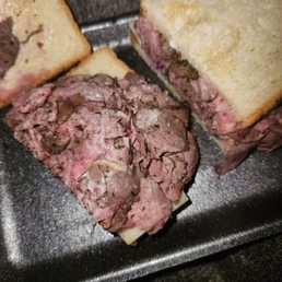 beef tenderloin sandwich with red onion and pepper jack on toasted white bread beef tenderloin sandwich with red onion and pepper jack on toasted white bread