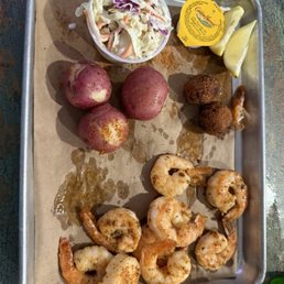 Grilled shrimp with new potatoes and cole slaw.