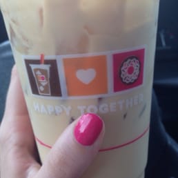 a hand holding a cup of coffee a hand holding a cup of coffee