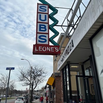 Leone's Sub & Pizza - a sign on the side of a building - Sandwiches Near Me - Somerville, Massachusetts