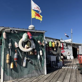 Sprague's Lobster - Blue sky and flags. - Seafood Near Me - Wiscasset, Maine