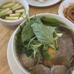 Pho Nam, gau, & bo vien with a side of fatty broth with scallions & vinegar onions Pho Nam, gau, & bo vien with a side of fatty broth with scallions & vinegar onions