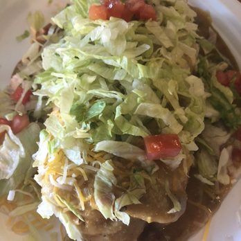 New Mexican Grill - Smothered pork green chili bean burrito top with cheese lettuce and tomato. Everything was absolutely delicious. - New Mexican Cuisine Near Me - Gilbert, Arizona New Mexican Grill - Smothered pork green chili bean burrito top with cheese lettuce and tomato. Everything was absolutely delicious. - New Mexican Cuisine Near Me - Gilbert, Arizona
