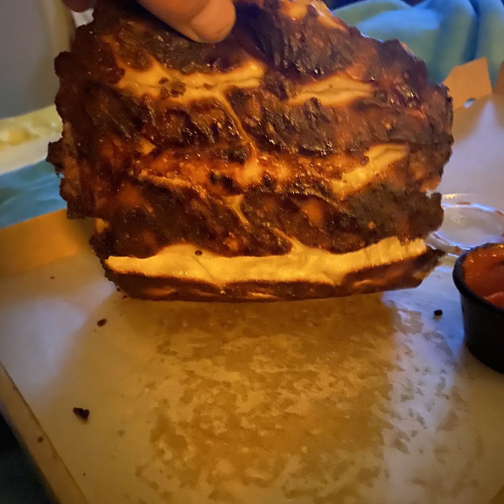 Garlic cheese bread was over done and the pizza was doughy.